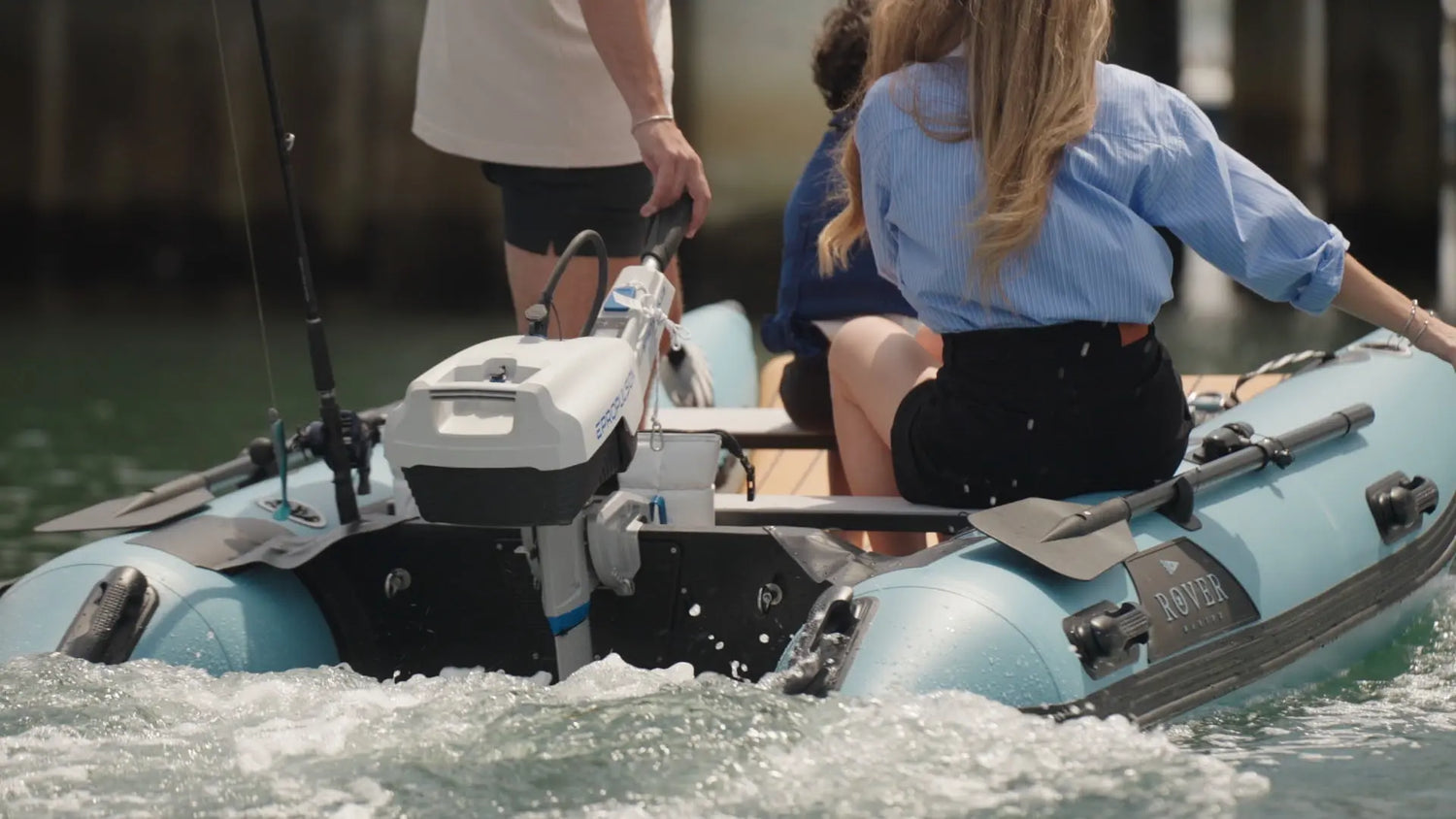 Passengers riding in inflatable boat on water