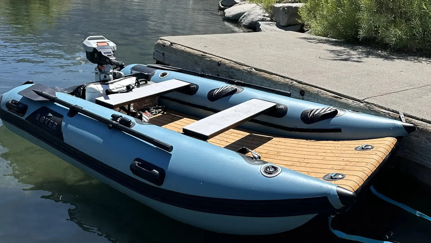 Inflatable dinghy boat docked at harbor showing construction quality