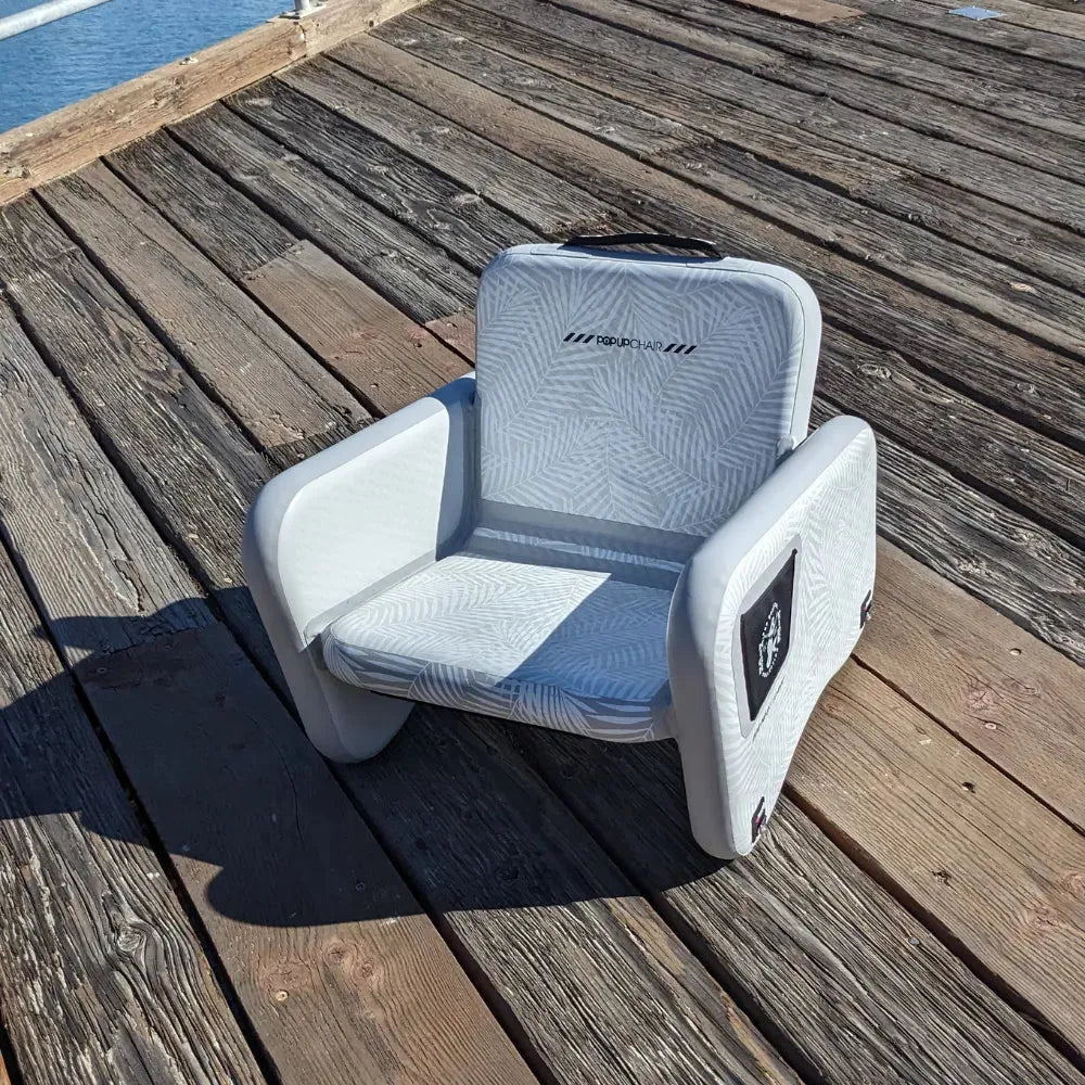 Angled view of Canadian Board Co. Inflatable POP Up Chair, lightweight and portable.