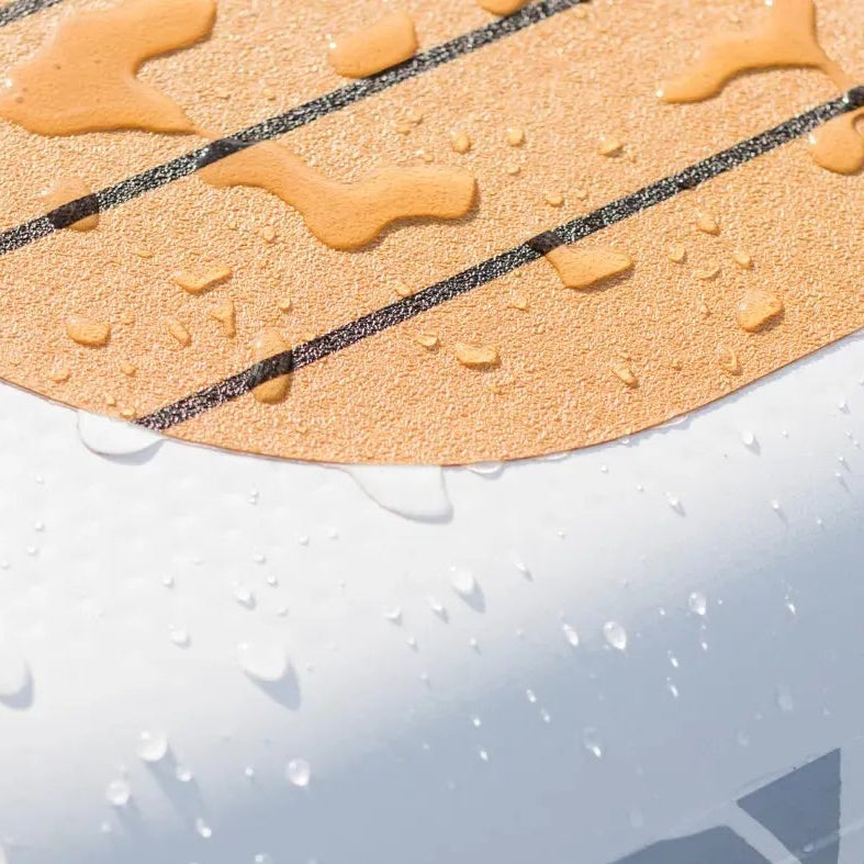 Close-up of the POPUP Dock corner showing the premium non-slip PVC traction pad with water droplets and a durable anchor D-ring attachment.