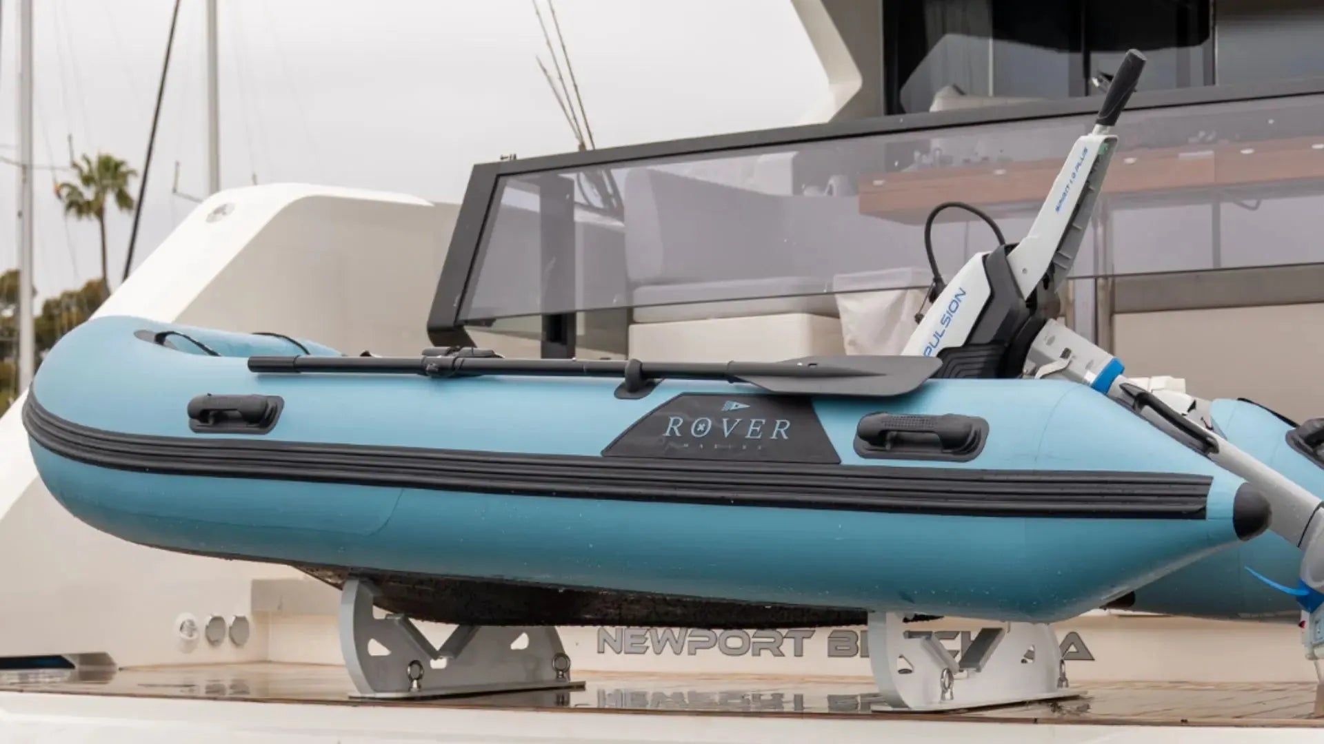 Rover Marine inflatable dinghy with motor at dock ready for maintenance